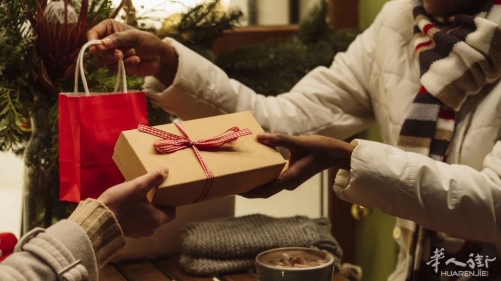 women-exchanging-gifts-with-each-other-on-christmas-royalty-free-image-1699024617.jpg